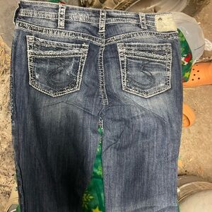 Silver Jeans Women's Distressed Boot Cut in Blue